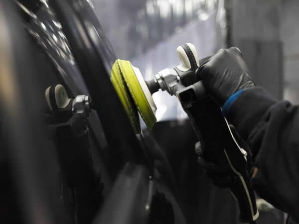 car-body-polishing-process-at-the-detailing-worksh-2022-01-28-00-02-04-utc-scaled-qdnrmv5aqgc9mw1ybdyk7kj7vkbjakg48akcqi7vys