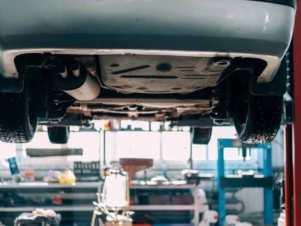 car-lifted-on-car-lift-for-routine-maintenance-2021-09-01-23-58-33-utc-scaled-qdnroghgbcirb3qo0kqsxo2c42gxc3rqs6cz0duvf8