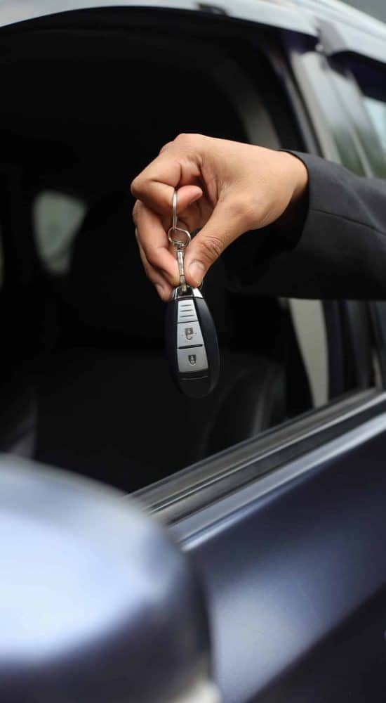 car-salesman-handing-over-car-key-2023-02-02-02-42-53-utc-scaled-qdnrds1g26lod57y6g7k8gnoxvp77cmrmc7st9m4cw
