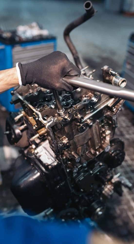 professional-mechanic-repairing-car-2021-08-27-22-49-36-utc-scaled-qdnr7rukeadq6txz8urdaz7ob9as0ysi4m64fmio40