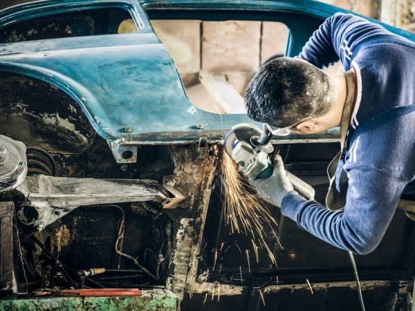 young-man-mechanical-worker-repairing-old-vintage-2022-12-09-04-47-20-utc-scaled-qdnrlqq8kksxrnonvehlqcqebzur3kznqqih3lvtec